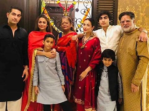 Anil Mehta (right) with his family in happier times. He's Malaika and Amrita Arora's step dad