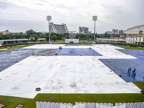 Shaheed Vijay Singh Pathik Sports Complex ground is covered amid persistent rains resulting in a washout on Day 3 of the one-off Test between New Zealand and Afghanistan in Greater Noida on Wednesday.