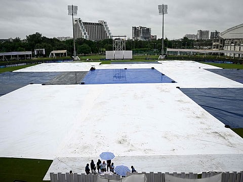 The covered field is pictured as it rains at the start of the one-off Test cricket match between Afghanistan and New Zealand at the Shaheed Vijay Singh Pathik Sports Complex in Greater Noida on Thursday.