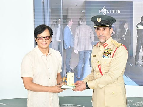 Lieutenant General Abdulla Khalifa Al Marri, Commander-in-Chief of Dubai Police, presenting a commemorative shield to Benjamin Abalos Jr, Interior Secretary of Philippines.