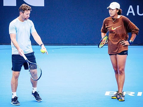File photo: Japan's Naomi Osaka (R) and coach Wim Fissette attend a training session ahead of the Brisbane International tennis tournament at Pat Rafter Arena in Brisbane on December 27, 2023. 