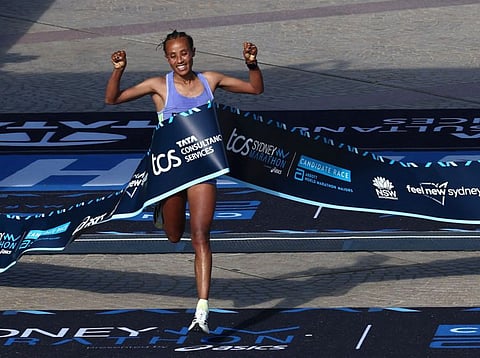 Ethiopian marathon runner Workenesh Edesa reacts as she wins the 2024 Sydney marathon on Sunday.