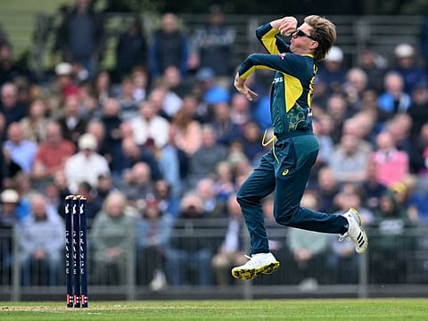 Australia's Adam Zampa bowls during the second Twenty20 International cricket match against Scotland at the Grange Cricket Club in Edinburgh, Scotland, on September 6.