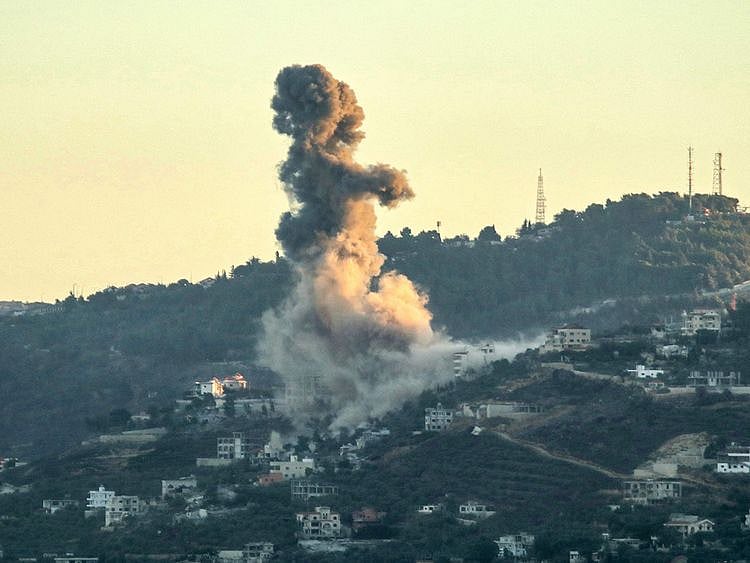 Smoke billows from the site of an Israeli strike
