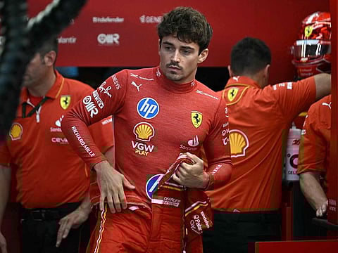 Ferrari's Charles Leclerc prepares before the first practice session ahead of the F1 Singapore Grand Prix at the Marina Bay Street Circuit in Singapore on Friday.