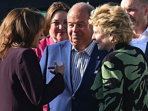 Democratic presidential nominee US Vice President Kamala Harris is greeted by Michigan Teamsters president Kevin Moore and Representative Debbie Stabenow, Democrat of Michigan, upon arrival at Detroit Metropolitan Wayne County Airport in Romulus, Michigan, on September 19, 2024.