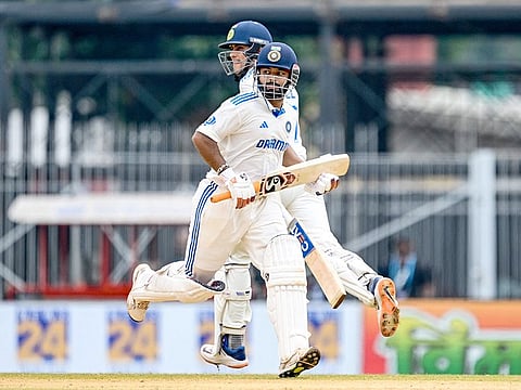 India's Rishabh Pant (R) and Shubman Gill run between the wickets during the third day of the first Test match against Bangladesh at the M.A. Chidambaram Stadium in Chennai on September 21, 2024. 