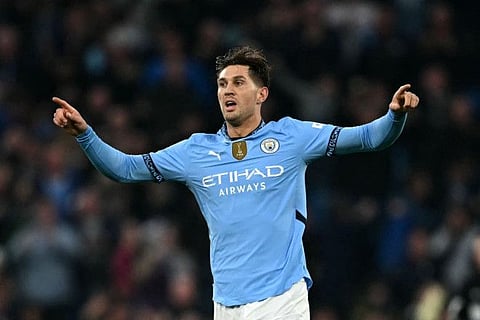 Manchester City’s defender John Stones celebrates scoring during the Premier League match against Arsenal at the Etihad Stadium in Manchester yesterday.