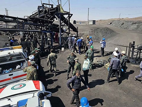 A handout picture provided by the Iranian Red Crescent (RCS) shows security forces gathered at the scene of a blast at a coal mine in Tabas in Iran's Khorasan province on September 22, 2024.
