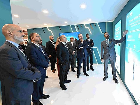 Mattar Al Tayer, Commissioner General for Infrastructure, Urban Planning, and Well-Being Pillar, and Director General, Chairman of the Board of Executive Directors of RTA, being briefed at the event