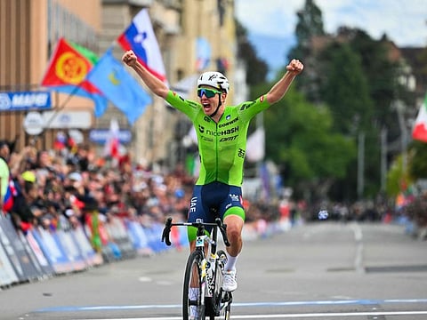 Slovenia's Tadej Pogacar celebrates as he crosses the finish line to win the men's Elite Road Race cycling event during the UCI 2024 Road World Championships, in Zurich, on Sunday.