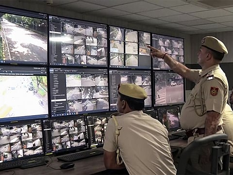 The Delhi Police personnel monitor the feed from hundreds of CCTV cameras in Delh