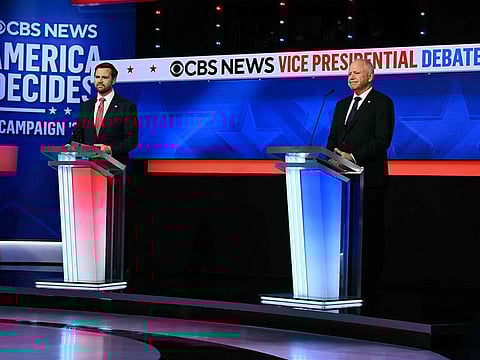 US Senator and Republican vice presidential candidate J.D. Vance (L) and Minnesota Governor and Democratic vice presidential candidate Tim Walz participate in the Vice Presidential debate hosted by CBS News at the CBS Broadcast Center in New York City.