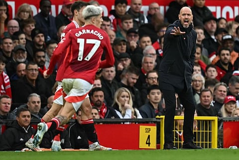 Manchester United's Dutch manager Erik ten Hag shouts instructions to the players from the touchline during the English Premier League football match between Manchester United and Tottenham Hotspur at Old Trafford in Manchester, north west England, on September 29.
