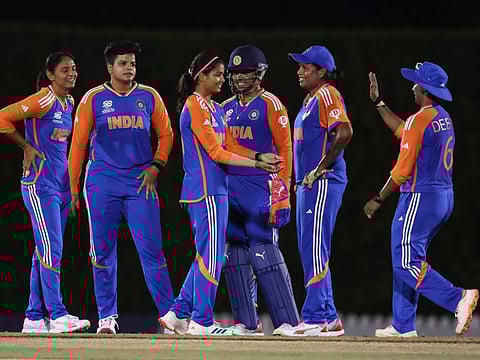 Indian women's team players celebrate their victory over South Africa in their final warm-up game in Dubai.