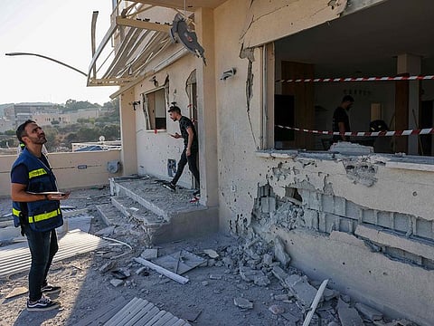 A man inspects the damage at a house hit during a rocket attack from southern Lebanon that targetted the northern Arab-Israeli village of Deir al-Asad on October 5, 2024.
