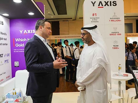 Clint Khan, Director of Y-Axis (Left), interacting with AlMehdar Ahmed, Head of Higher Education Classification & Rating Framework,  Knowledge & Human Development Authority (KHDA), at the Y-Axis booth at Gulf News Edufair 