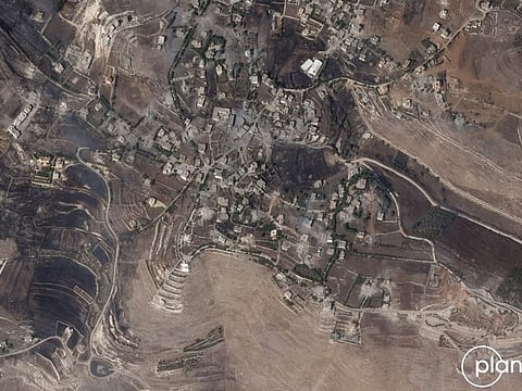 This handout satellite picture provided by Planet Labs PBC and dated on October 5, 2024, shows burnt areas in Lebanon's southern Maroun Al Ras village, amid the ongoing war between Israel and Hezbollah militants.  