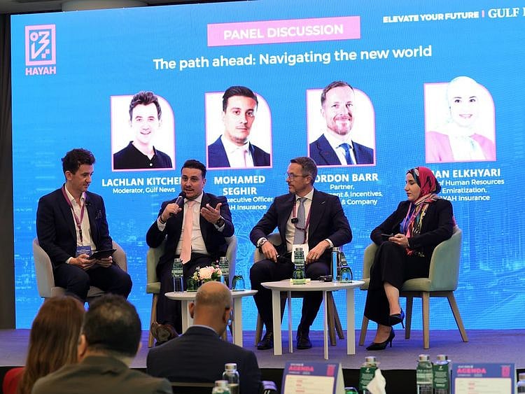 From left: Lachlan Kitchen, Moderator; Mohamed Seghir, CEO of HAYAH Insurance; Gordon Barr, Partner, Employment & Incentives at Al Tamimi & Company; and Iman Elkhyari, Head of Human Resources & Emiratisation at HAYAH Insurance during the panel discussions on The Path Ahead - Navigating the New World