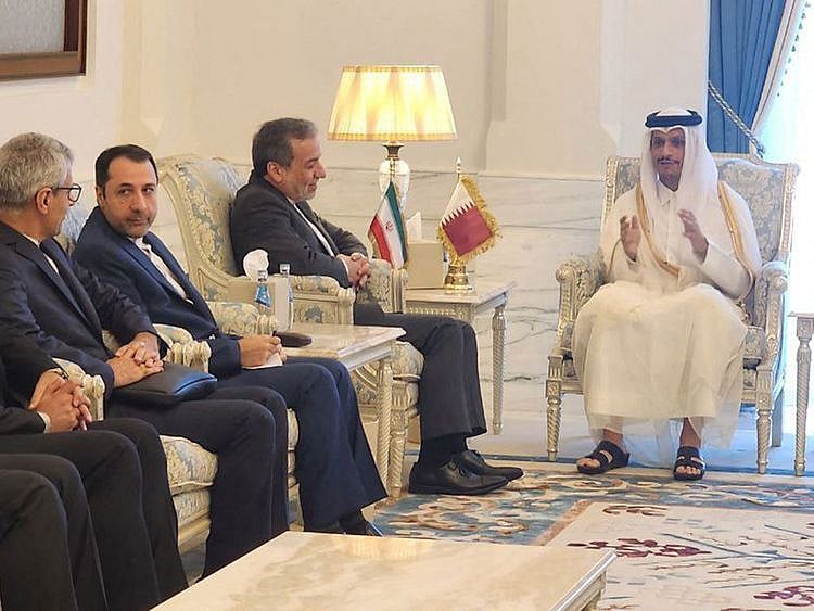 Qatar's Prime Minister and Minister of Foreign Affairs Sheikh Mohammed bin Abdulrahman bin Jassim Al Thani with Iran's Foreign Minister Abbas Araghchi and a delegation in Doha on October 10, 2024.  