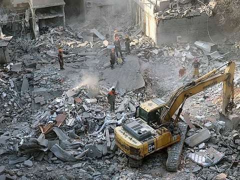 Lebanese civil defence work at the site of an Israeli air strike in the Basta area, in Beirut, on October 11, 2024, amid the ongoing war between Israel and Hezbollah. 