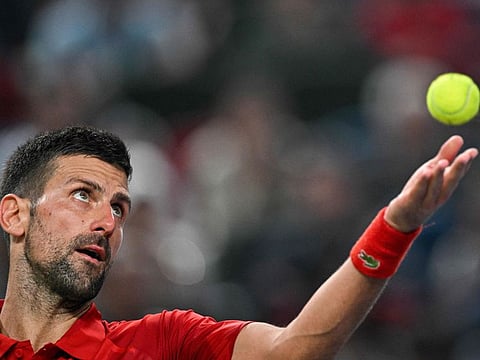 Serbias Novak Djokovic serves to Czech Republics Jakub Mensik during their men's singles match at the Shanghai Masters on Friday.