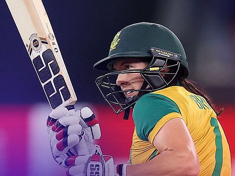  South Africa’s Tazmin Brits plays a sweep shot en route to her 42 in a Group B game against Bangladesh in the Women’s T20 World Cup at the Dubai International Cricket Stadium on October 12, 2024. South Africa won by seven wickets.