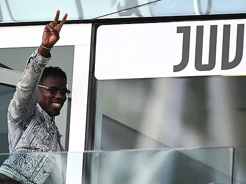 French forward Paul Pogba waves as he arrives to attend the Italian Serie A match between Juventus and Cagliari at the Allianz stadium in Turin last week.