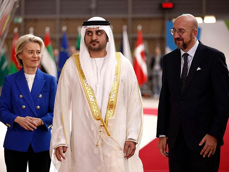 Sheikh Maktoum bin Mohammed is flanked by European Council President Charles Michel and President of the European Commission Ursula von der Leyen as they arrive to attend a EU- Gulf Cooperation Council (GCC) summit in Brussels on October 16, 2024.  