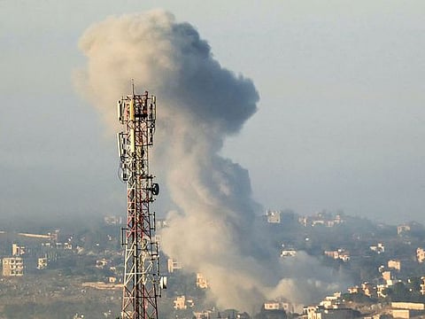 Smoke billows from the site of an Israeli air strike on the village of Taybeh in southern Lebanon on October 15, 2024. 