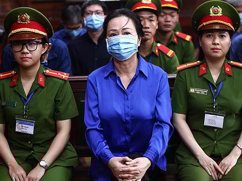 Vietnamese property tycoon Truong My Lan (C) looks on at a court in Ho Chi Minh City on October 17, 2024.