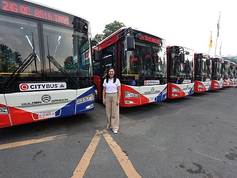 Joy Belmonte, Mayor of Quezon City, poses next to 8 electric buses that will serve city residents. The project bolsters the city's commitment to pioneering environmentally sustainable practices, the local executive said.