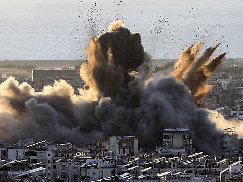 A cloud of smoke erupts following an Israeli airstrike on Beirut's southern suburbs on October 19, 2024.   
