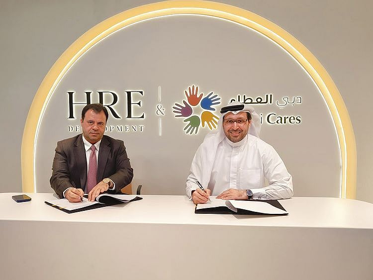 Mohamed-Adib-Hijazi,-Chairman,-HRE-Development-and-Dr-Tariq-Al-Gurg,-CEO-and-Vice-Chairman-of-Dubai-Cares,-during-the-signing-ceremony.JPG-1729596547592