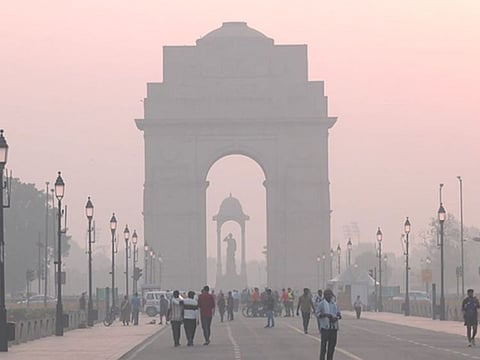 A view of India Gate covered in a thin layer of smog as the AQI drops further in New Delhi 