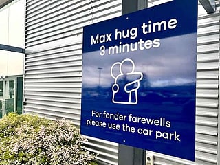New Zealand airport sets three-minute limit on hugs