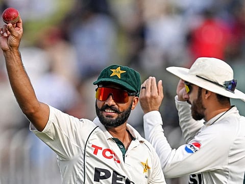 Pakistan's Sajid Khan gestures after taking a five-wicket haul during the first day of the third and final Test cricket match against England at the Rawalpindi Cricket Stadium in Rawalpindi on Thursday.