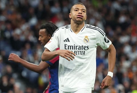Real Madrid's Kylian Mbappe gestures during the Spanish league match against Barcelona at the Santiago Bernabeu stadium in Madrid on Saturday.