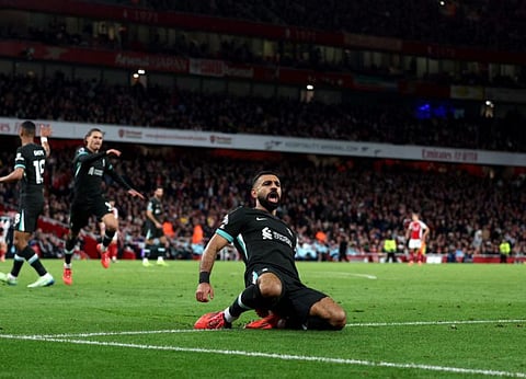 Liverpool striker Mohamed Salah celebrates after scoring the team's second goal during the English Premier League match against Arsenal at the Emirates Stadium in London on Sunday.