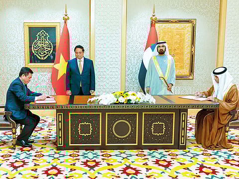 Sheikh Mohammed Bin Rashid and Pham Minh Chinh witness the signing of the UAE-Vietnam Comprehensive Economic Partnership Agreement by Dr Thani Bin Ahmad Al Zeyoudi, Minister of State for Foreign Trade, and Nguyen Hong Dien, Vietnam’s Minister of Industry and Trade.