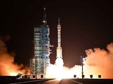A long March-2F carrier rocket carrying the Shenzhou-19 spacecraft and crew of three astronauts lifts off from the Jiuquan Satellite Launch Center, in the Gobi desert, northwest China, on October 30, 2024. 