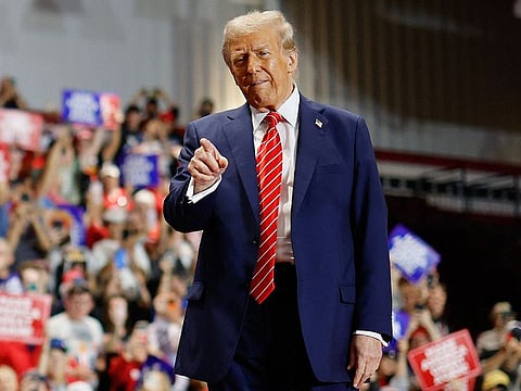 Republican presidential nominee, former US President Donald Trump greets supporters during a campaign event at the Rocky Mount Event Center on October 30, 2024 in Rocky Mount, North Carolina. 