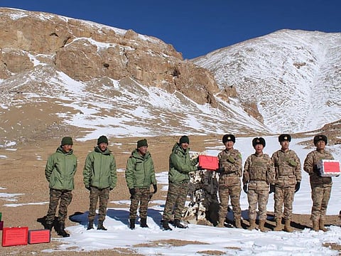 Indian and Chinese army greet each other along the Line of Actual Control (LAC) near Karakoram pass in Ladakh on October 31, 2024, on the occasion of Diwali.  