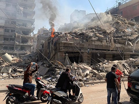 People check the devastation in the aftermath of Israeli strikes in the neighbourhood of Haret Hreik in Beirut's southern suburbs on November 1, 2024, amid the ongoing war between Israel and Hezbollah.  