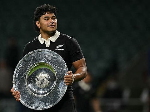 New Zealand's flanker Wallace Sititi celebrates with the trophy after the Autumn Nations Series International rugby union test match between England and New Zealand at the Allianz Stadium, Twickenham in south-west London.