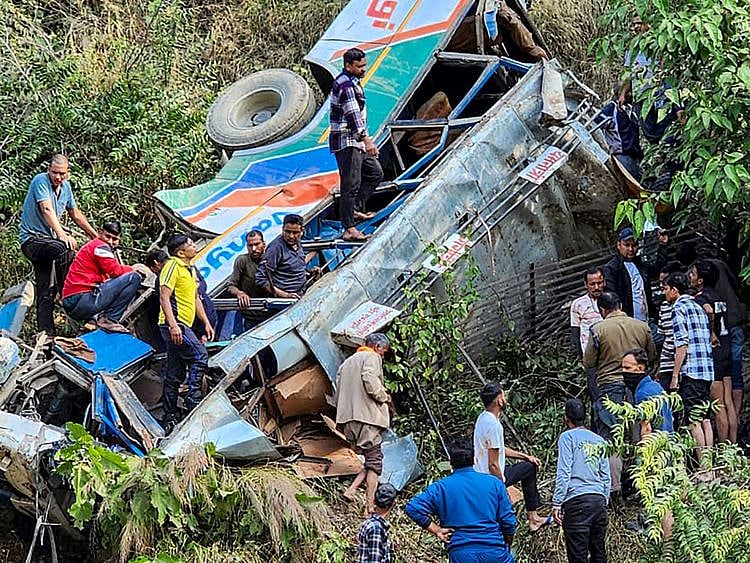  Photographs released by government rescue teams showed the crumpled wreckage of the bus in thick undergrowth, with the twisted front of the vehicle squashed nearly flat.