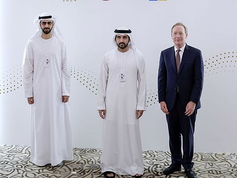 Sheikh Hamdan bin Mohammed bin Rashid Al Maktoum, Crown Prince of Dubai, Deputy Prime Minister, Minister of Defence, and Chairman of The Executive Council of Dubai, with Omar Sultan Al Olama, Minister of State for Artificial Intelligence, Digital Economy, and Remote Work Applications, and Brad Smith, Vice Chairman and President of Microsoft, on the sidelines of the UAE Government Annual Meetings in Abu Dhabi on Wednesday 