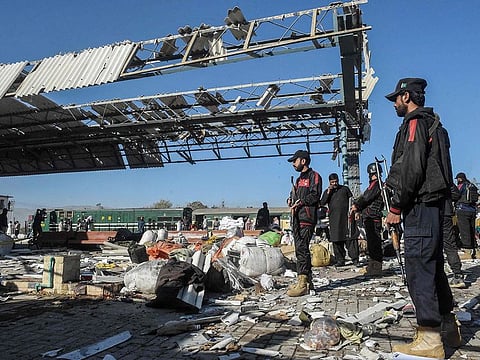 Security personnel inspect the blast area after an explosion at a railway station in Quetta, in Pakistan's Balochistan province on November 9, 2024.   