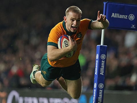 Australia's Max Jorgensen dives over the line to score their late winning try during the Autumn Nations Series International rugby union test match between England and Australia at the Allianz Stadium, Twickenham in south-west London, on November 9, 2024. 