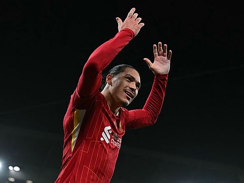 Liverpool's Uruguayan striker #09 Darwin Nunez celebrates after scoring the opening goal during the English Premier League football match between Liverpool and Aston Villa at Anfield in Liverpool.